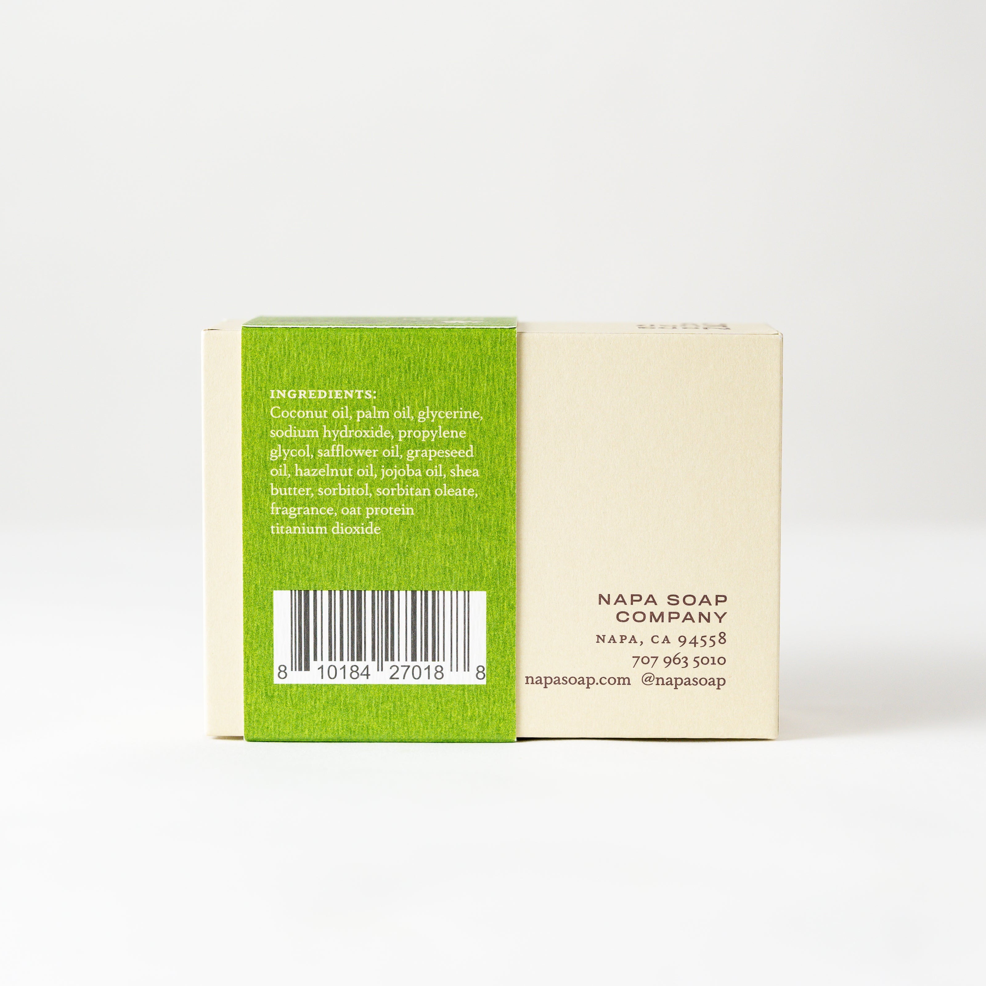 Bar of soap with a green label on a white background