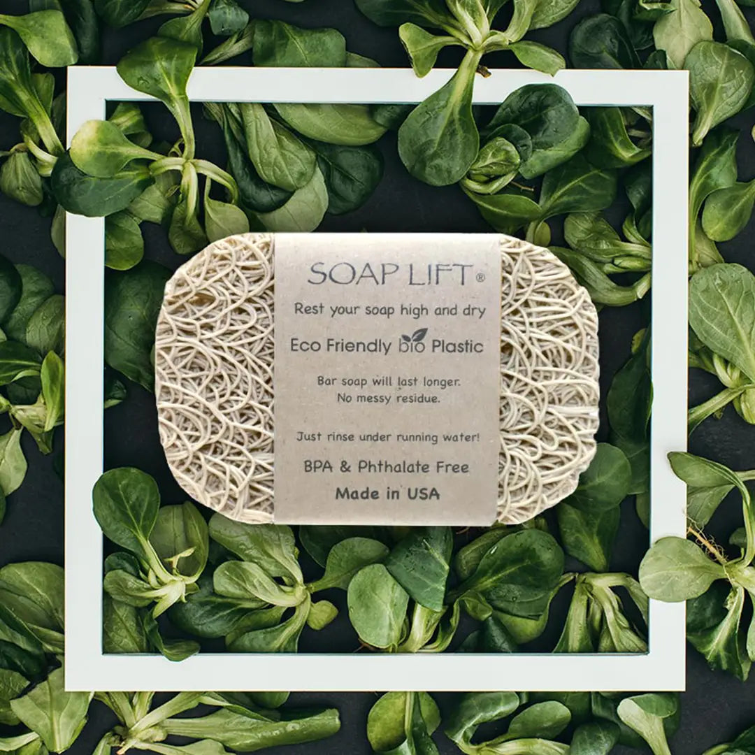 Soap lift with eco-friendly label on a bed of green leaves